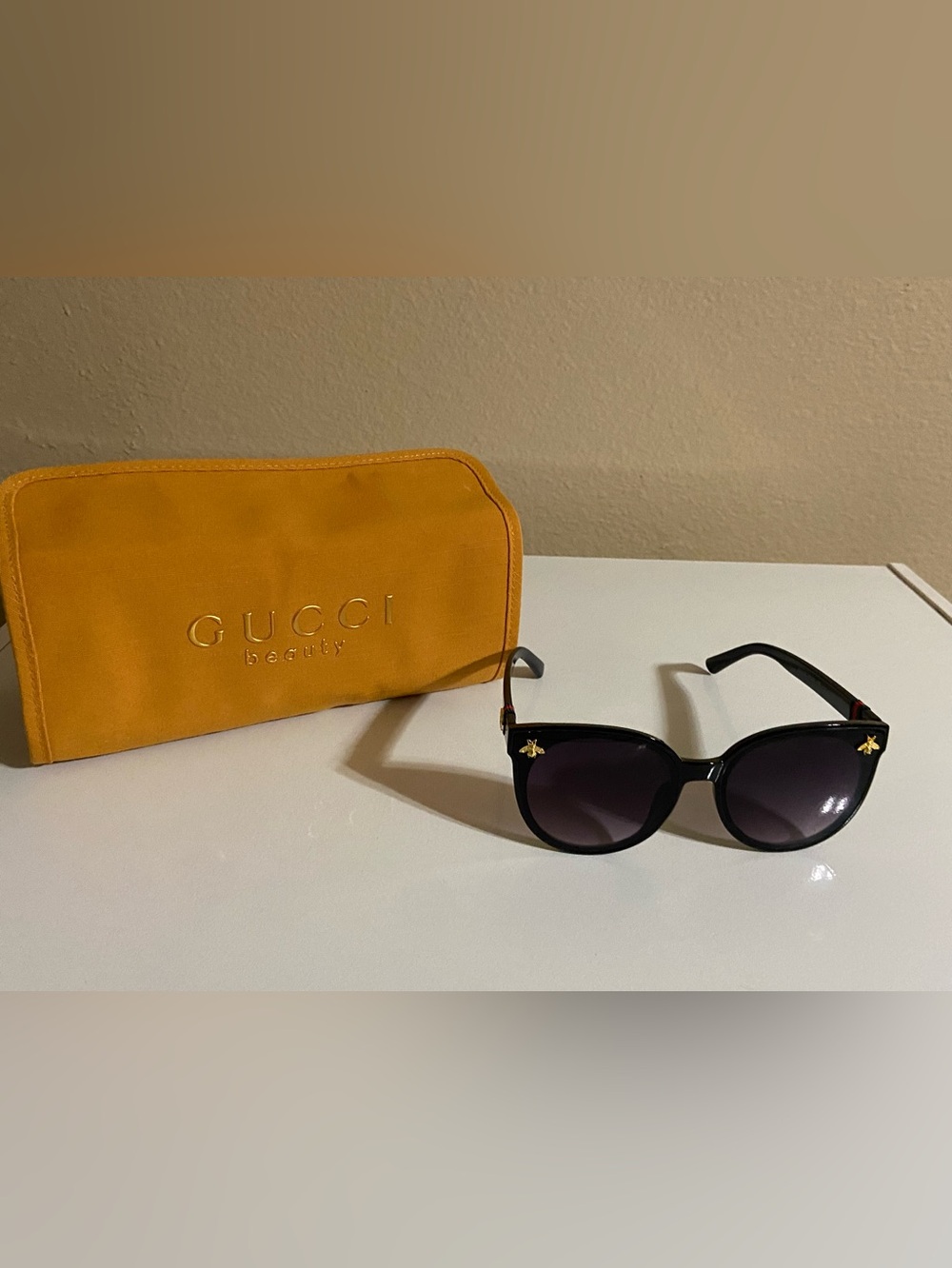Gucci Women’s Black Cat-Eye Sunglasses with Gold Bee Details